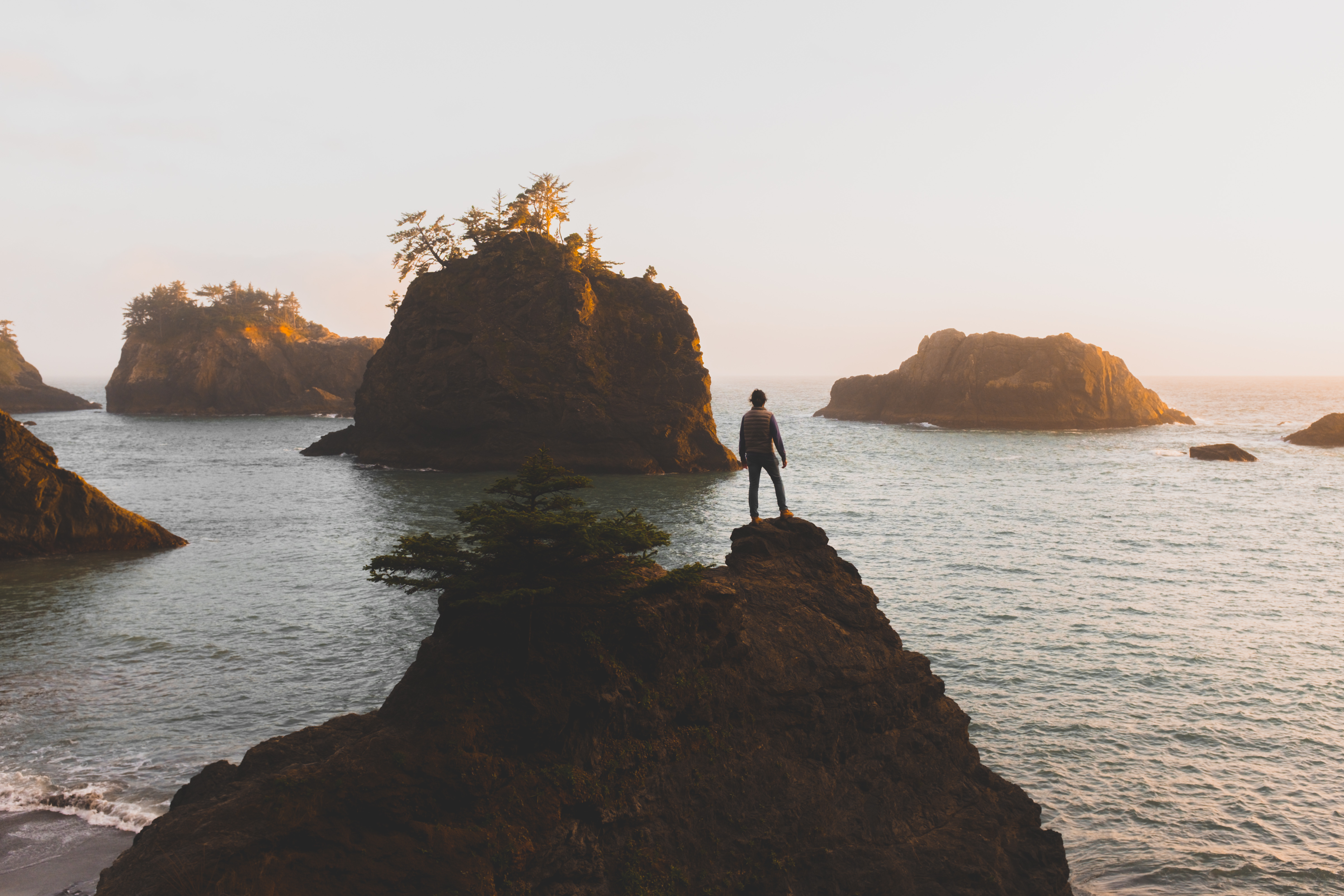 A man stands on a cliff