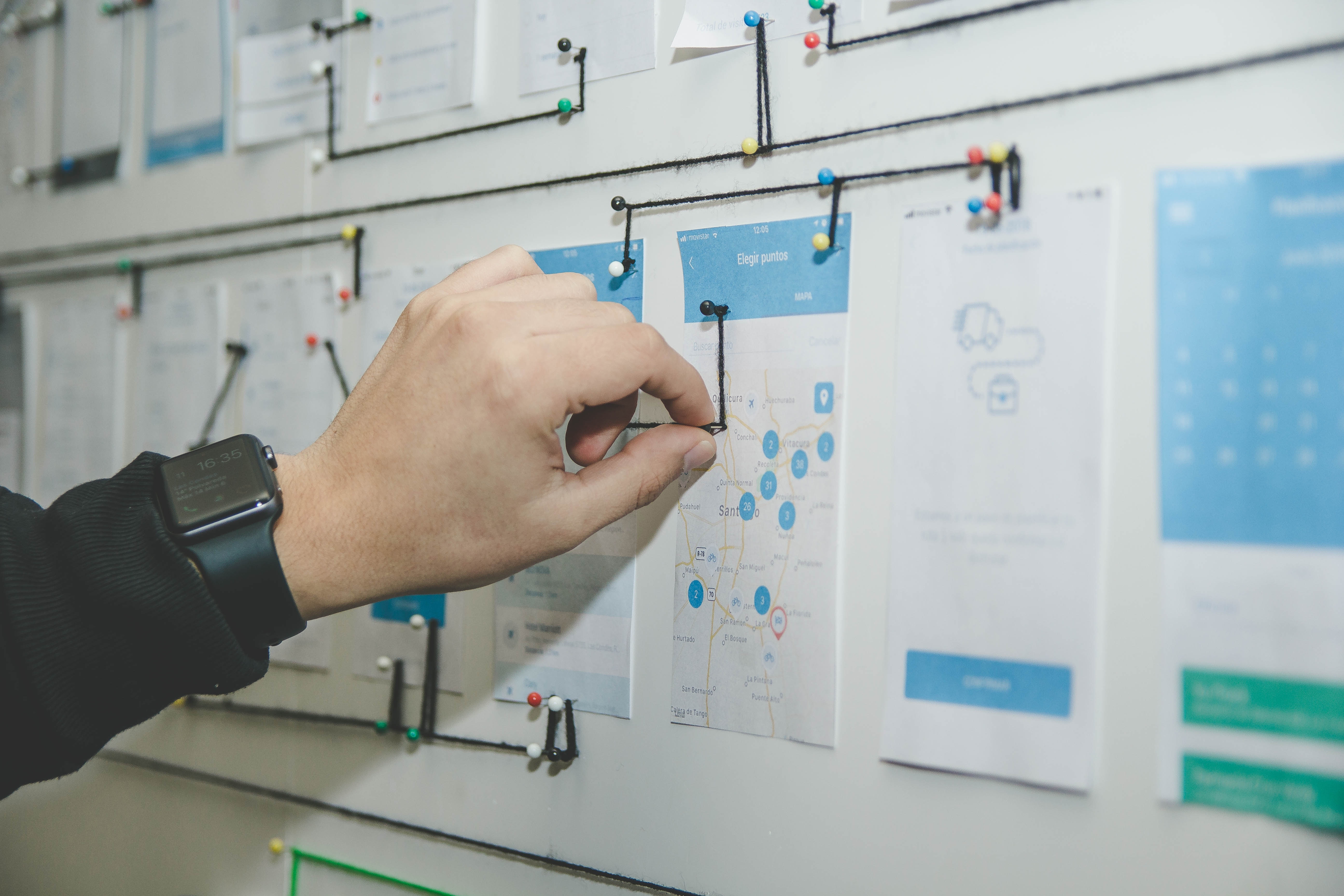 How to Approach a Design System Person working on blue and white paper on board