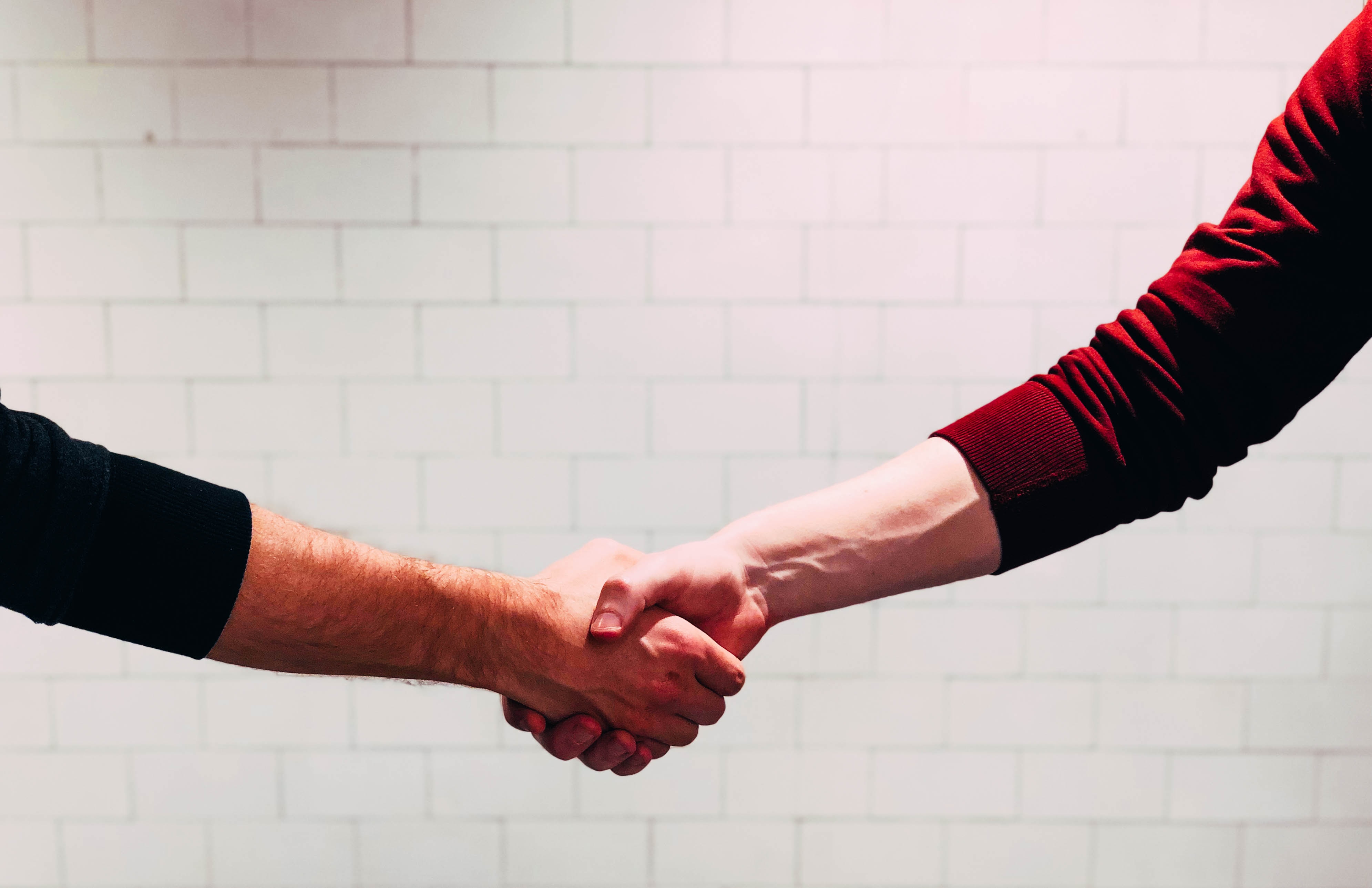 Two people shaking hands Two people shaking hands